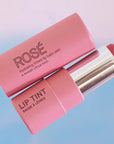Pink House Organics Lip Tint - Rose - open lip balm tube next to cap lifestyle 