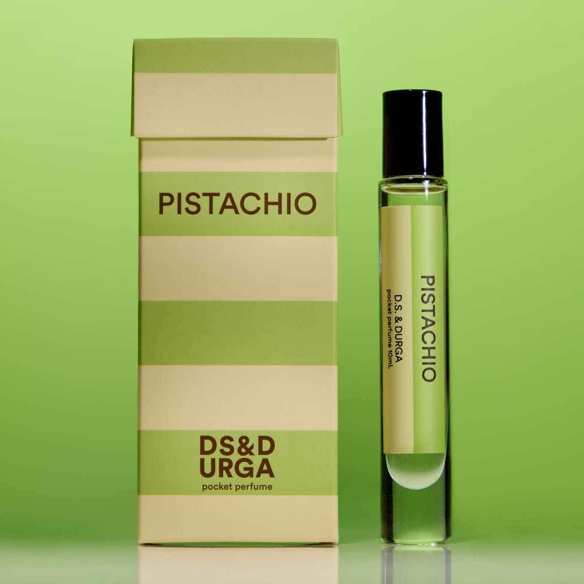 Lifestyle shot of D.S. & Durga Pistachio Pocket Perfume - pocket perfume next to packaging