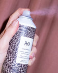 R+Co Chainmail Thermal Protection Styling Spray - Model shown spraying product