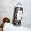 R+Co Chainmail Thermal Protection Styling Spray - Product shown on towel