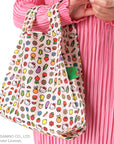 Baggu Baby Reusable Bag - Hello Kitty Icons - Closeup of product on models arm