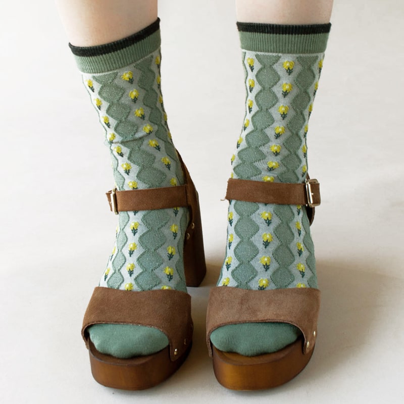 Tiepology Little Daisy Diamond Shape Socks - Warm Sage- Closeup of model wearing product