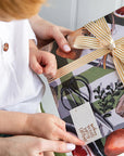 Bespoke Letterpress Cream Gold Foil Striped Ribbon - Models shown holding gift with ribbon