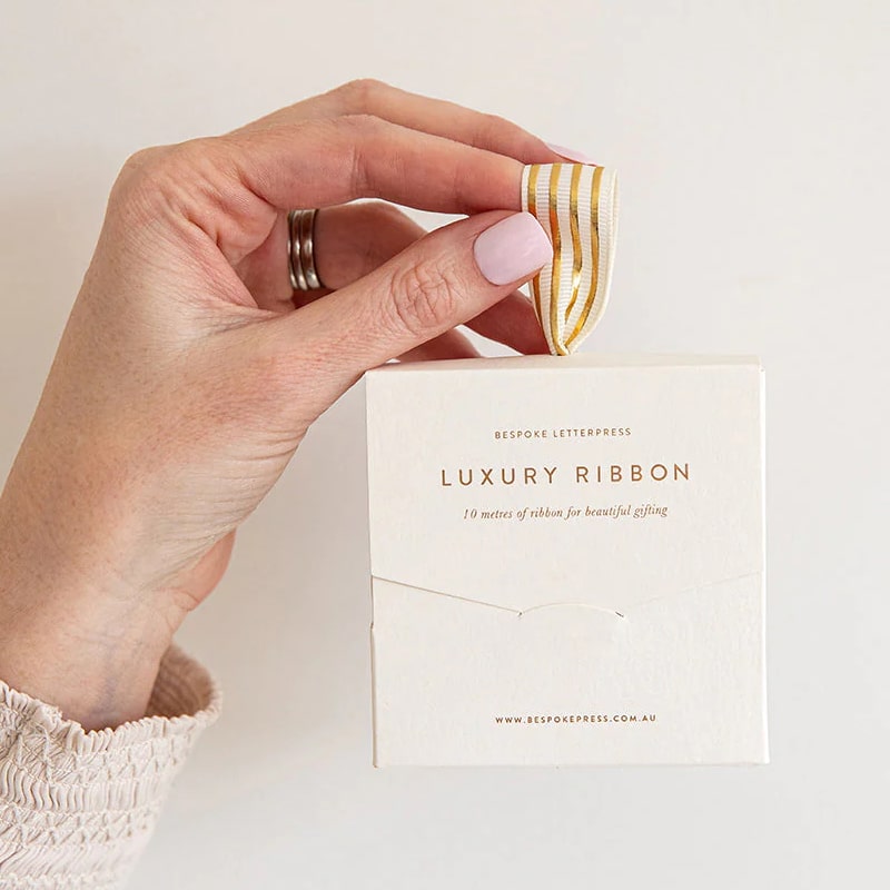 Bespoke Letterpress Cream Gold Foil Striped Ribbon - Model shown holding ribbon box