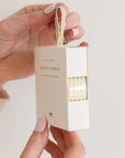 Bespoke Letterpress Cream Gold Foil Striped Ribbon - Model shown holding ribbon box