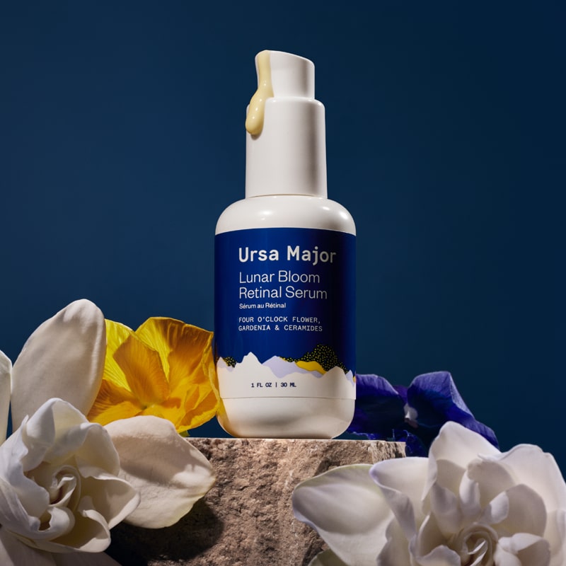 Ursa Major Lunar Bloom Retinal Serum - Beauty shot, product shown with flowers