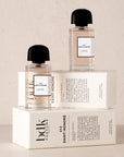 BDK Parfums 312 Saint-Honore Eau de Parfum - Perfume bottles stacked on top of packaging 