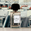 BDK Parfums 312 Saint-Honore Eau de Parfum - Bottle in front of photo of buildings