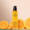 Odacite C-Glow Hydra-Firm Body Oil - Beauty shot, product shown with oranges