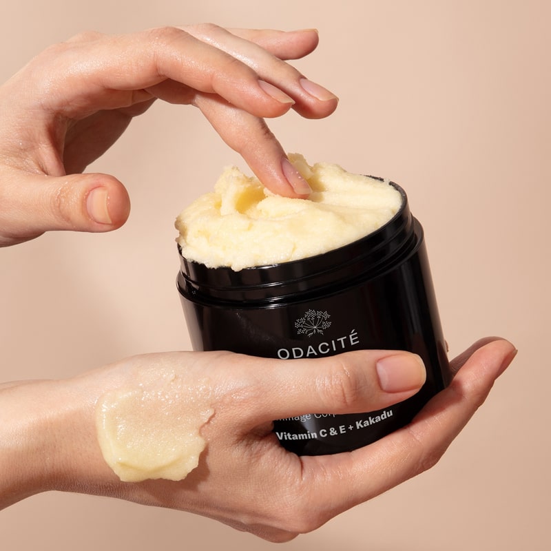 Odacite C-Smooth Hydra-Firm Body Polish - Model shown applying product to hand