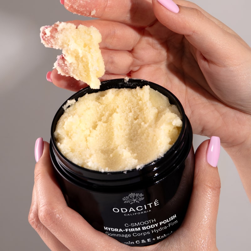 Odacite C-Smooth Hydra-Firm Body Polish - Model shown with product on hand (227 g)