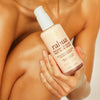 Rahua Enchanted Island Body Glow Cream- Model shown holding product in hand