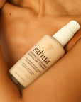 Rahua Enchanted Island Body Glow Cream - Product shown on models chest