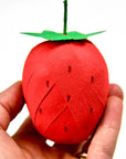 TOPS Malibu Mini Surprize Ball Strawberry - Closeup of product in models hand