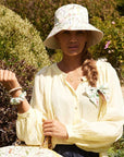 Fable England Meadow Creatures Marshmellow Bucket Hat- Model shown wearing product