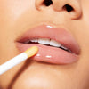 Nuxe Reve de Miel® Honey Lip Care- Closeup of model applying product