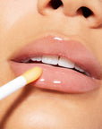 Nuxe Reve de Miel® Honey Lip Care- Closeup of model applying product