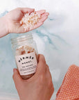 Artifact Mer-Mer Monoi Sea Potion Soothing Mineral Bath - Product shown in models hands