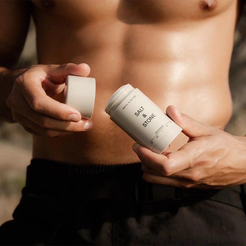 Salt & Stone Santal & Vetiver Deodorant - Model shown with product in hand