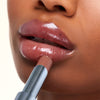 Kosas Wet Stick Moisturizing Lip Shine - 100 Degrees - Closeup of model applying product