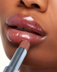 Kosas Wet Stick Moisturizing Lip Shine - 100 Degrees - Closeup of model applying product