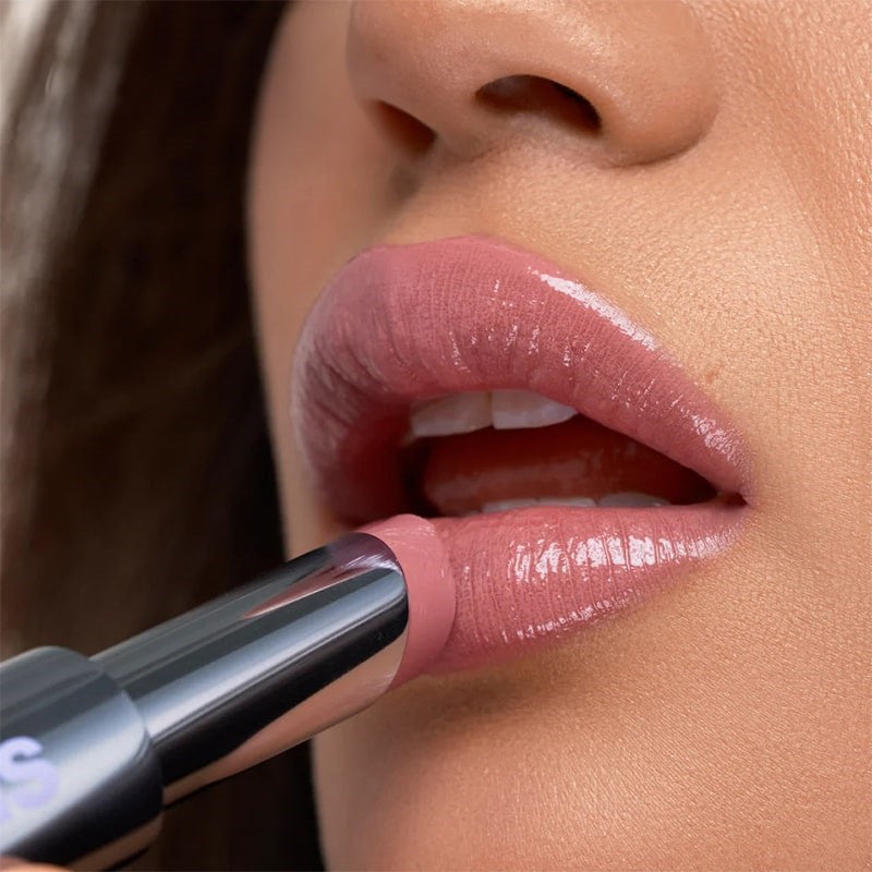 Kosas Wet Stick Moisturizing Lip Shine - Baby Rose - Closeup of model applying product