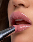 Kosas Wet Stick Moisturizing Lip Shine - Baby Rose - Closeup of model applying product
