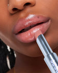 Kosas Wet Stick Moisturizing Lip Shine - Hot Beach - Closeup of model applying product