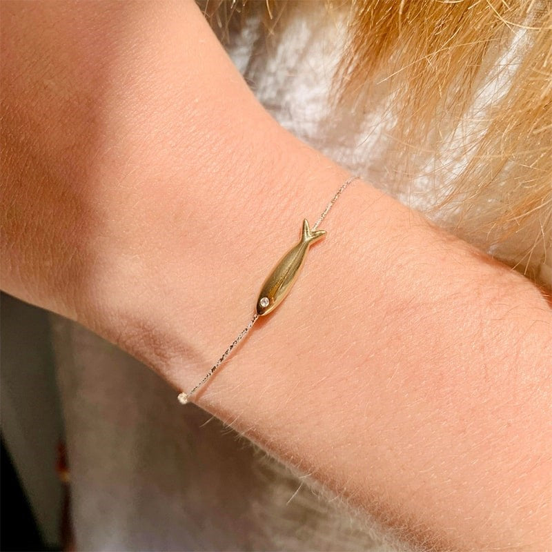 Sophie Deschamps Bijoux Gold Plated Long Fish Bracelet - Closeup of product on models wrist