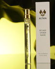 ALTAIA By Any Other Name Eau de Parfum Travel Size - product shown next to packaging in front of paper on yellow background