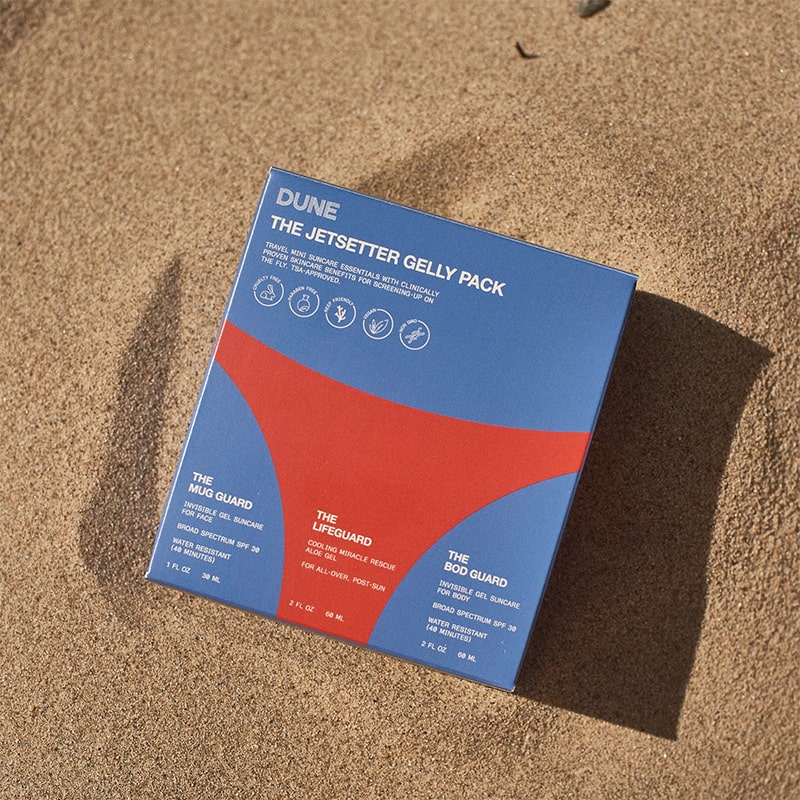 DUNE Suncare The Jetsetter Gelly Pack- Product shown in sand