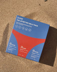 DUNE Suncare The Jetsetter Gelly Pack- Product shown in sand