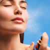 Augustinus Bader The Face Mist - Model shown spraying product onto face