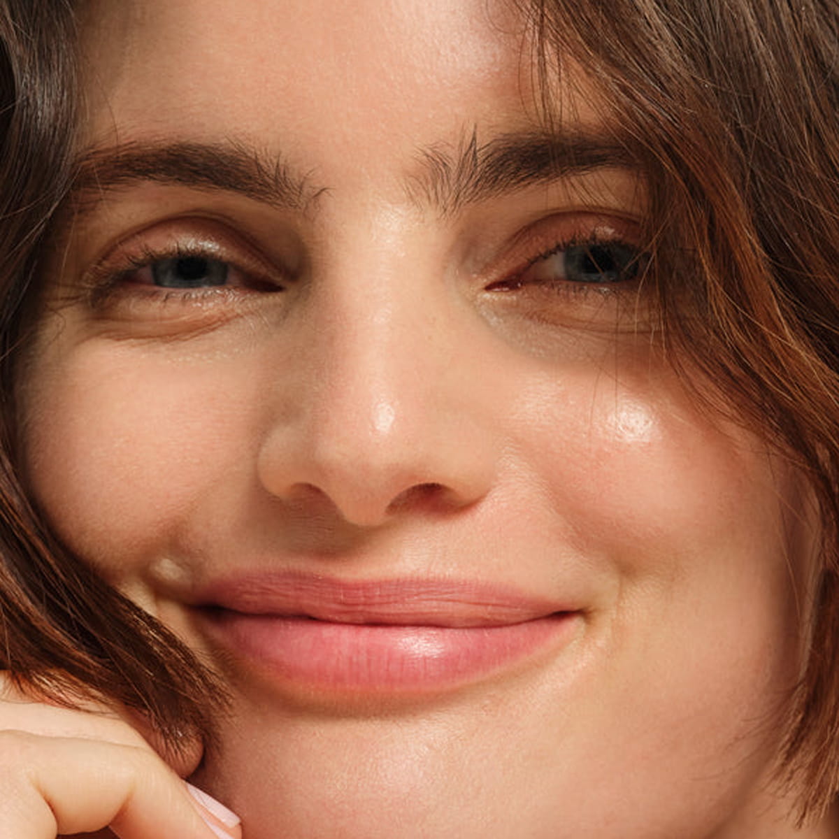 Model wearing Chantecaille Limited Edition Rose de Mai Radiant Lip Balm (2.5 g)