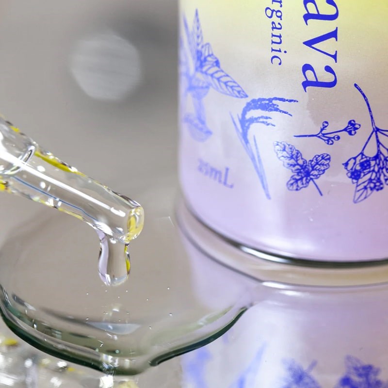 Frenava Emollient Oil - Closeup of product droplet next to bottle