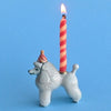 Camp Hollow Poodle Cake Topper - side view of cake topper with lit candle