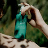 Kerzon Natural Liquid Soap - Menthe Poivrée (500 ml) - product shown being balanced on model's shoulder. 