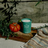Kerzon Fragranced Candle - Fleur de Romarin (190 g) - product shown next to tomato's on a cutting board. 