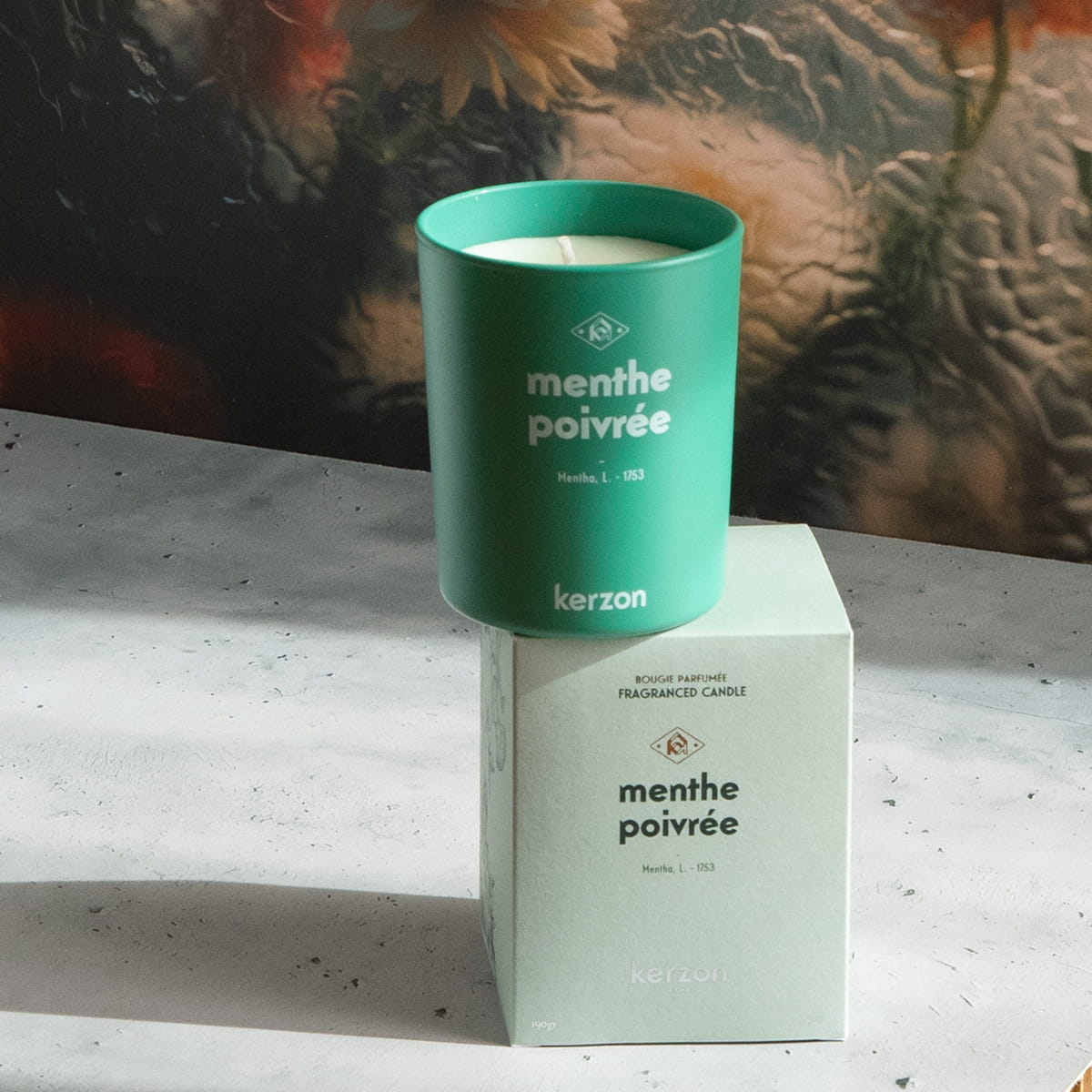 Kerzon Fragranced Candle - Menthe Poivrée (190 g) - product shown stacked on top of packaging.