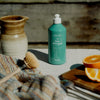Kerzon Dishwashing Liquid - Fleur d'Oranger (500 ml) - product shown on table with orange slices.