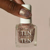 Tenoverten Nail Polish - Bleecker - model holding nail polish bottle