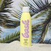 Bask Sunscreen SPF 50 Non-Aerosol Spray Sunscreen - product shown in sand in front of palm trees