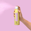 Bask Sunscreen SPF 50 Non-Aerosol Spray Sunscreen - model spraying product 