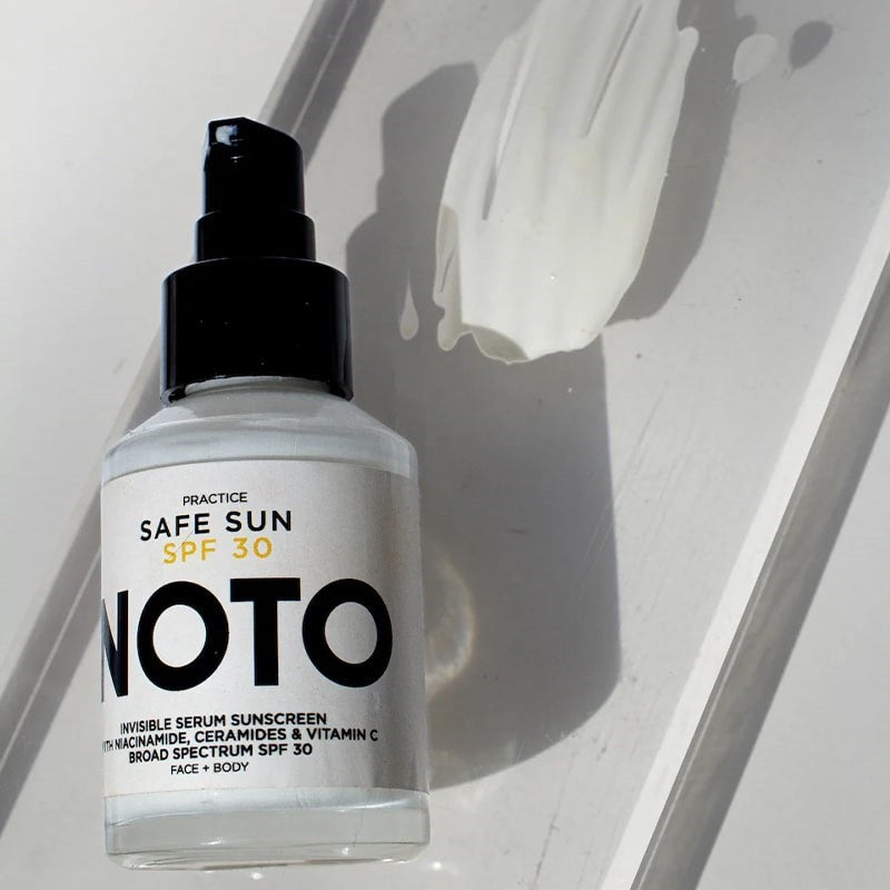 NOTO Botanics (Practice) Safe Sun SPF 30 - bottle next to sunscreen texture swatch