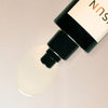 Close up of ISUN Lapis Soothing Body Oil (100 ml) showing product swatch