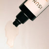 Close up of ISUN Carnelian Energizing Body Oil (100 ml) showing product swatch