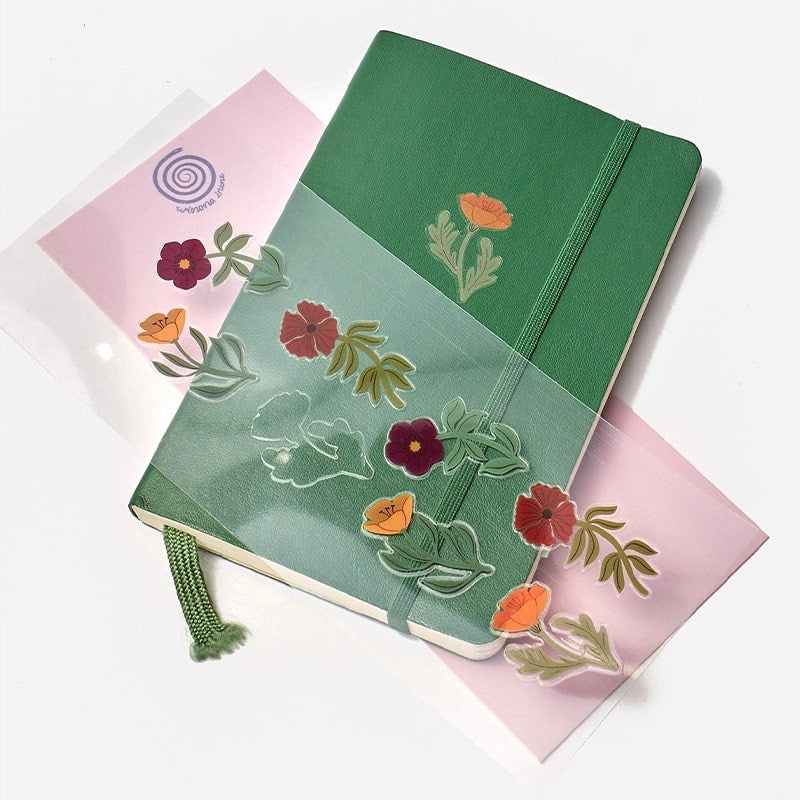 Winona Irene Meadow Sticker Sheet - Product shown on top of notebook