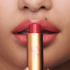 Augustinus Bader The Tinted Lip Balm - Shade 1 - model shown holding product to lips