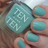 Tenoverten Nail Polish - Liberty - model holding product and wearing nail polish