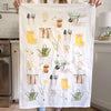 Emily Lex Studio Garden Tea Towel - model shown holding tea towel showing full product